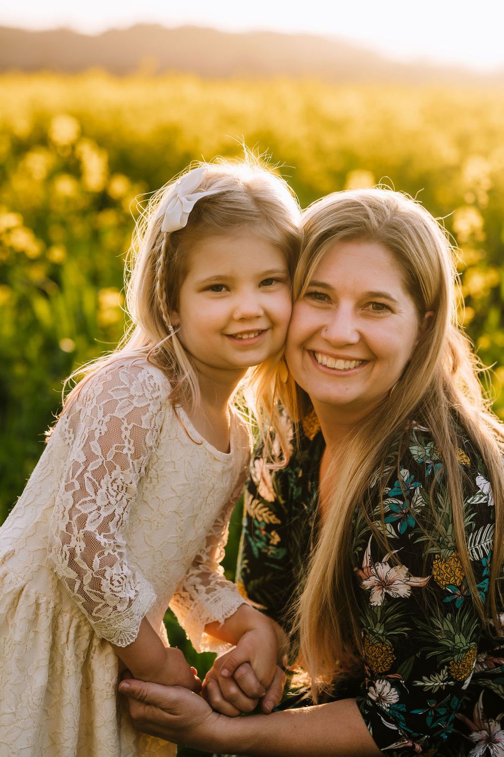 Sonoma County family photography spring session in the blooming mustard fields of wine country showing parents of their