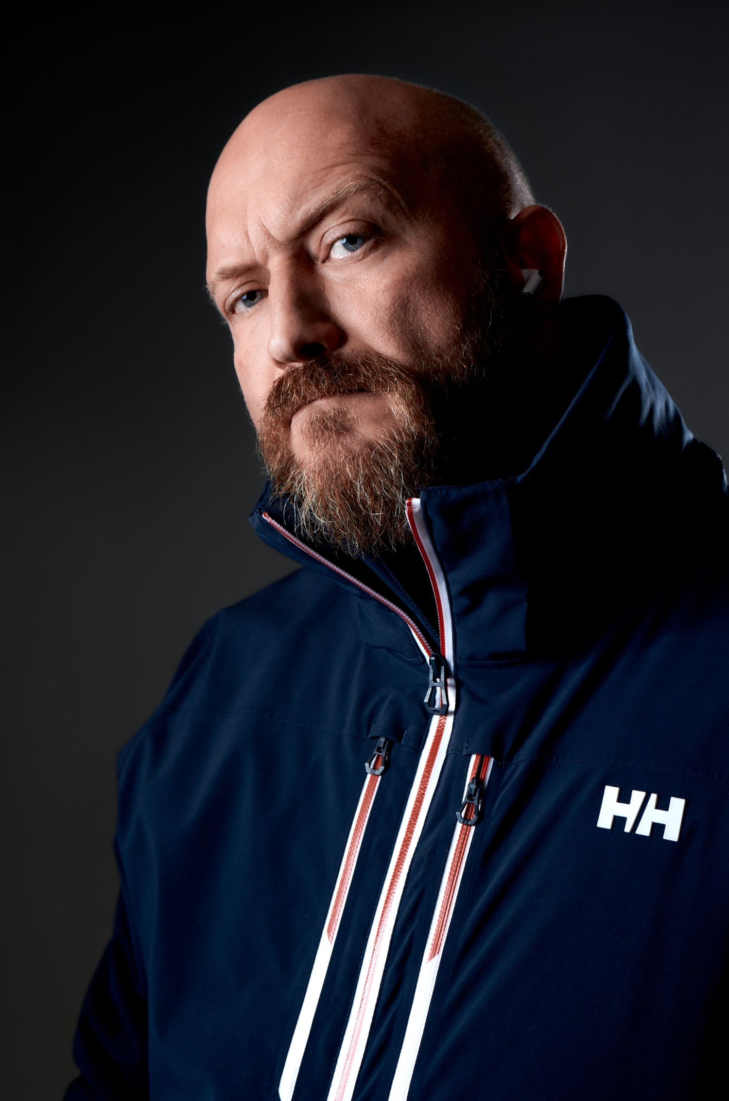 Low key portrait of photographer Craig Travis.