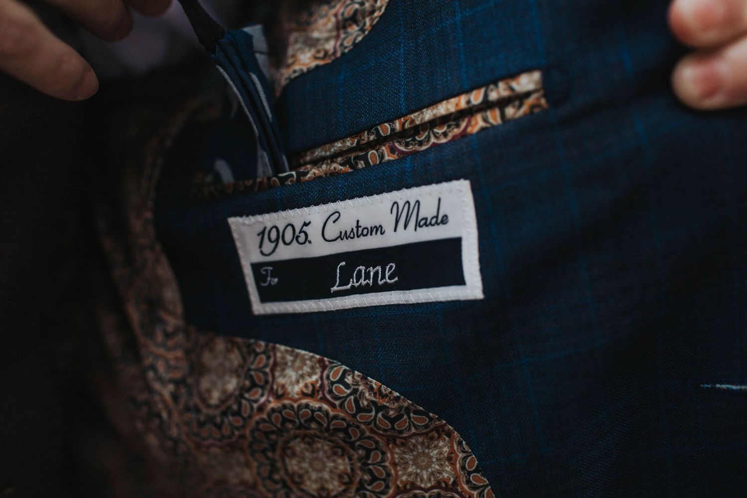 Suit jacket details on Jos A. Bank jacket at Greenville, NC wedding.