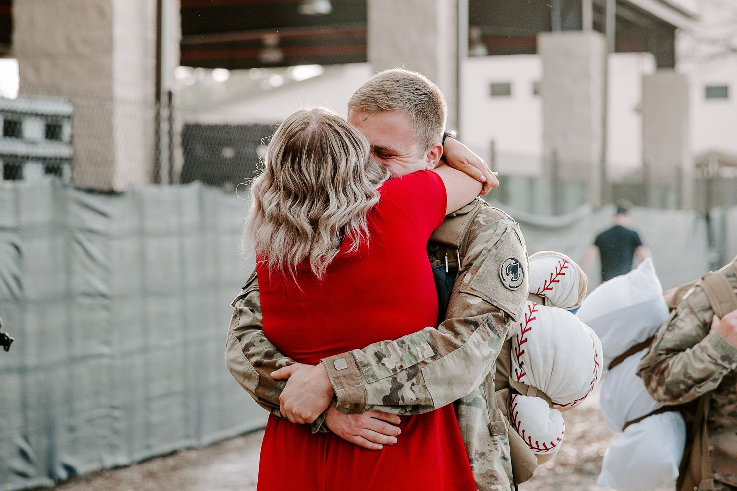 wife and husband embracing after the husband got back from deployement