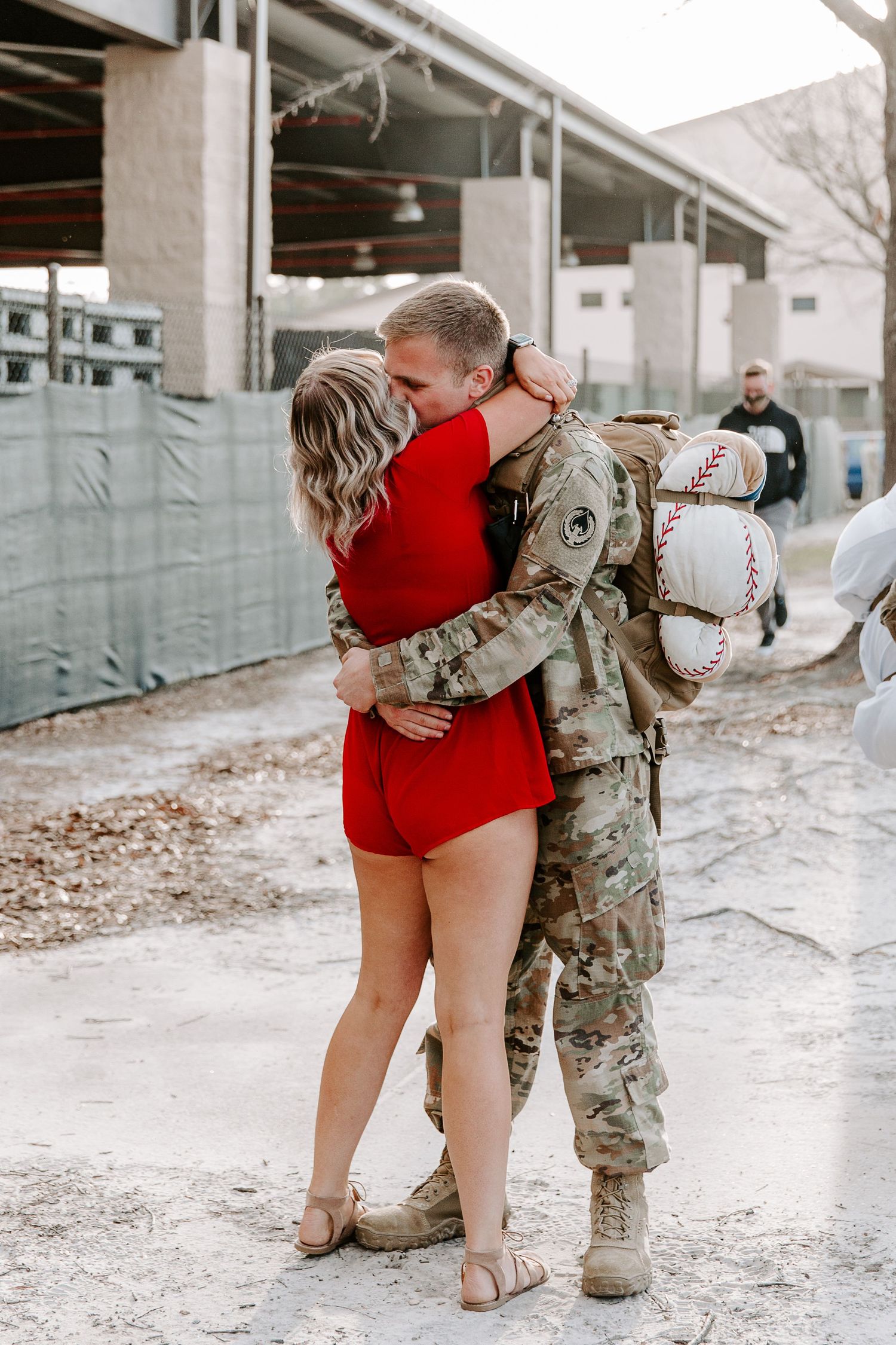 couple embracing after the husband got back from his Air Force deployment