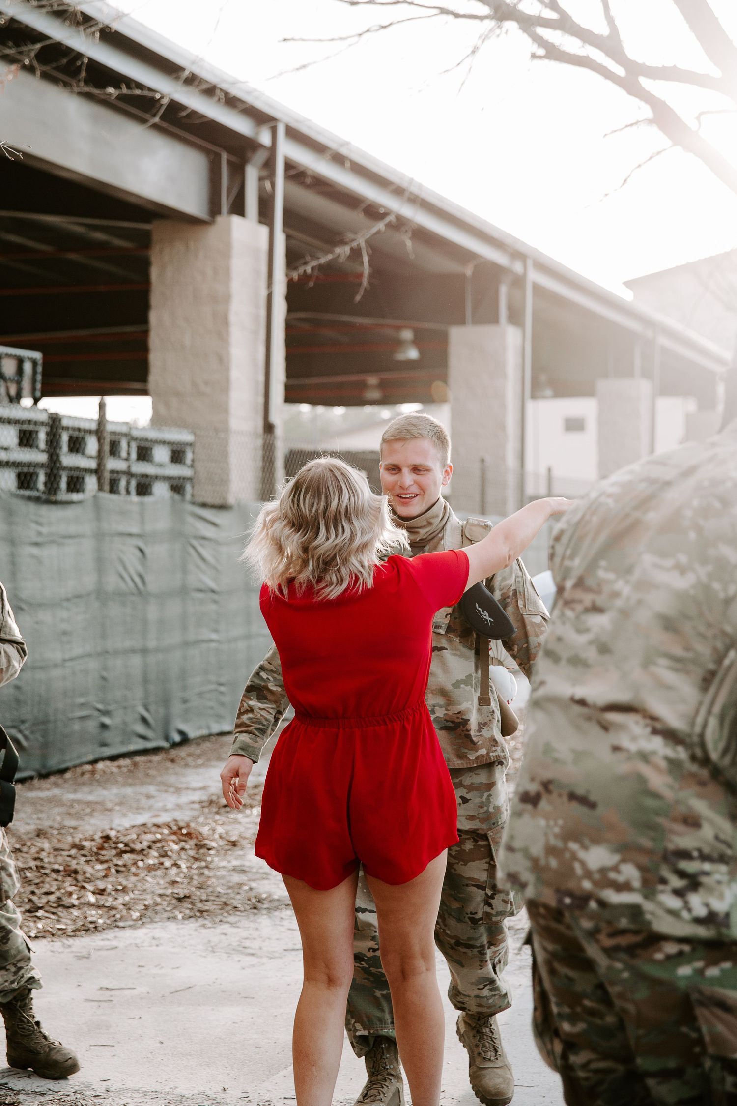woman running to her husband after seeing each other for the first time in six months