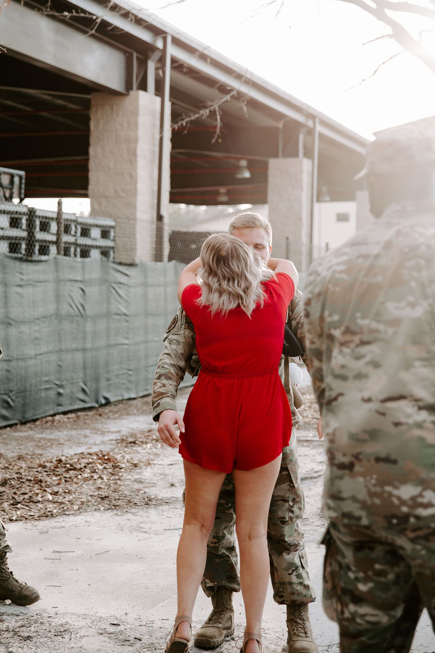 man about to wrap his arms around his wife after not seeing her while he was deployed
