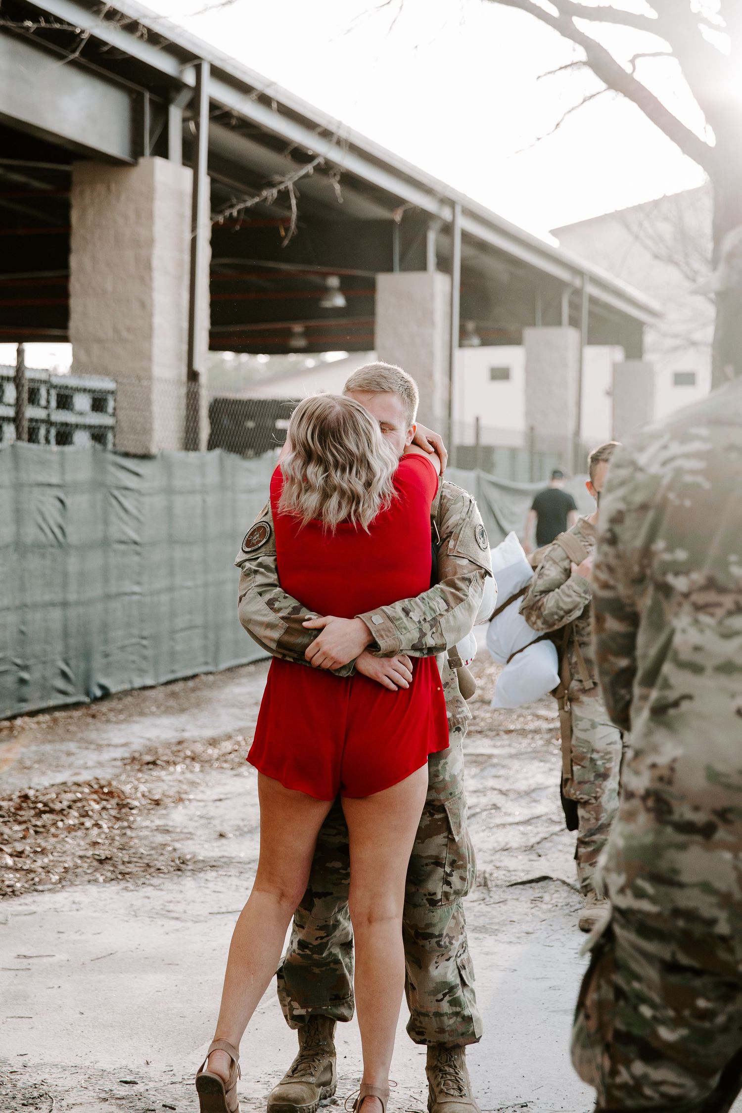 couple embracing during their Fort Walton Beach military base homecoming