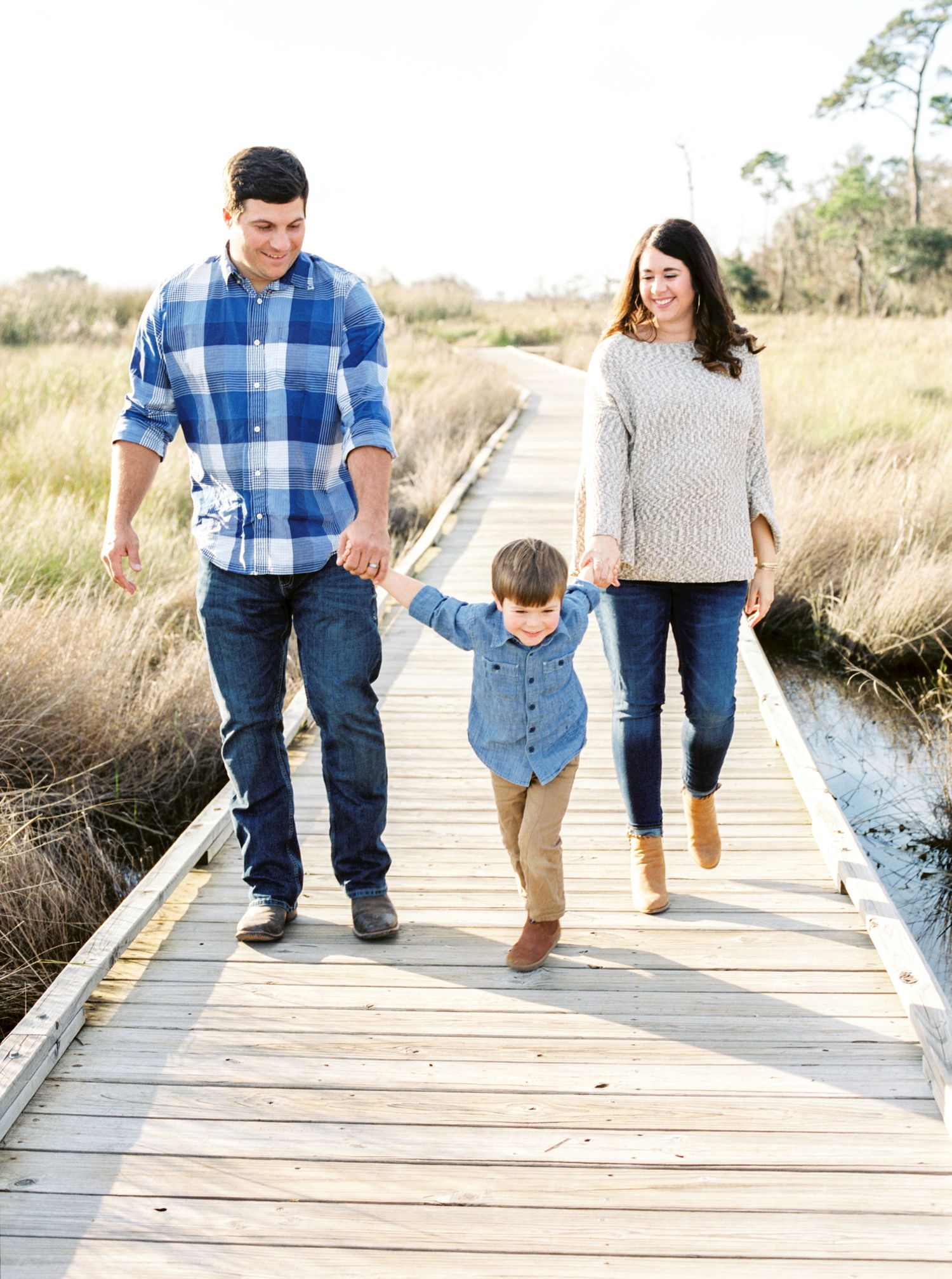 Louisiana family portrait of a Hammond family at the Fontainebleau State Park boardwalk
