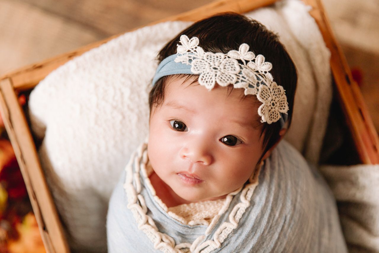 lee's summit newborn photography baby girl awake looking at camera