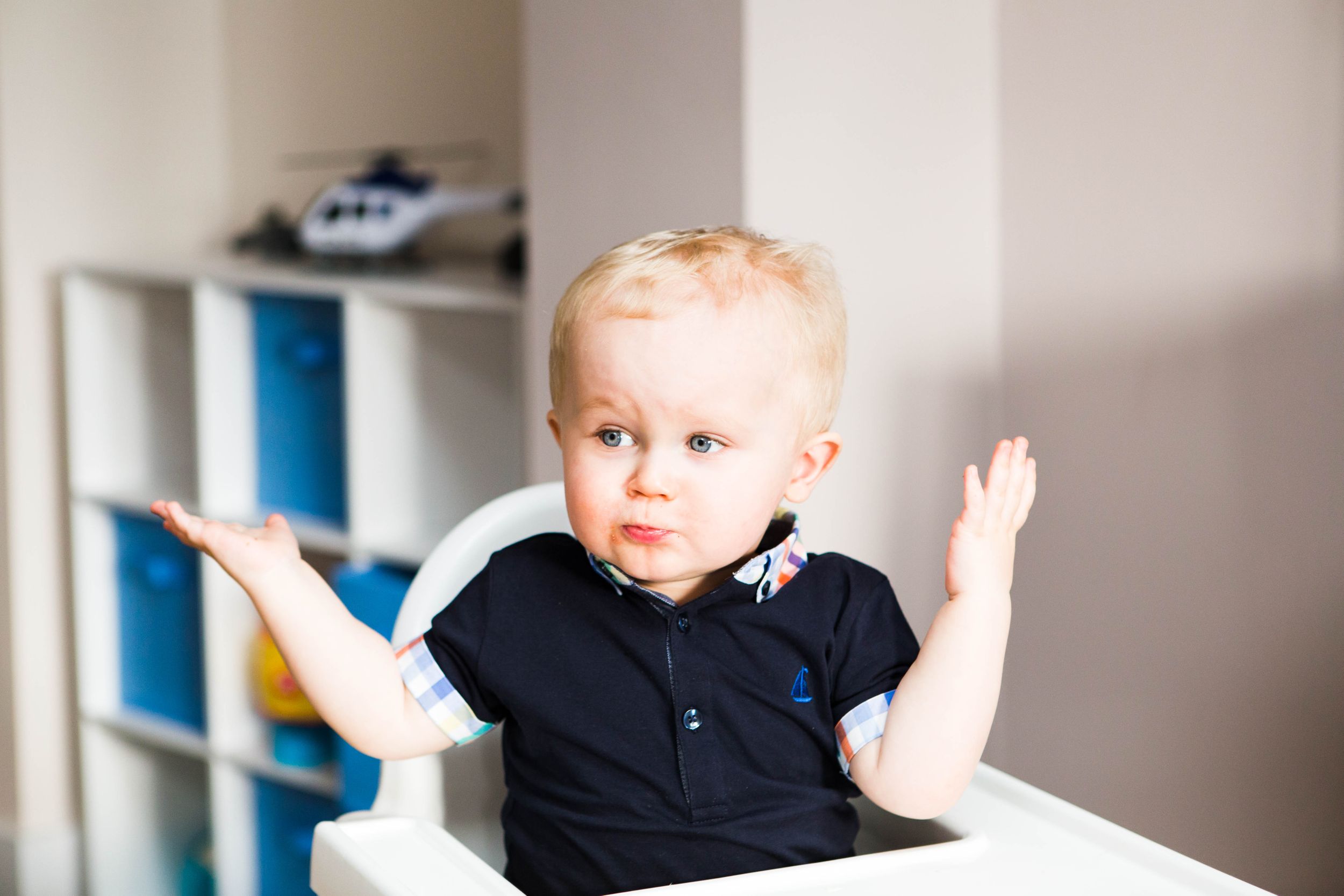 toddler blonde boy confused