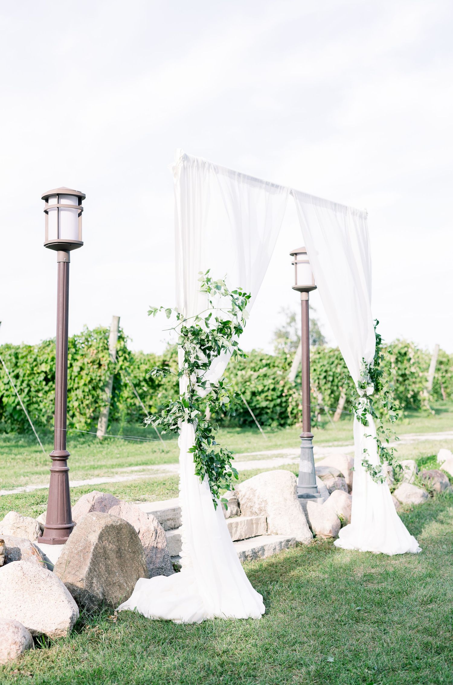 Vineyard photos with white willow events at Prairie Moon Winery wedding in Ames, Iowa