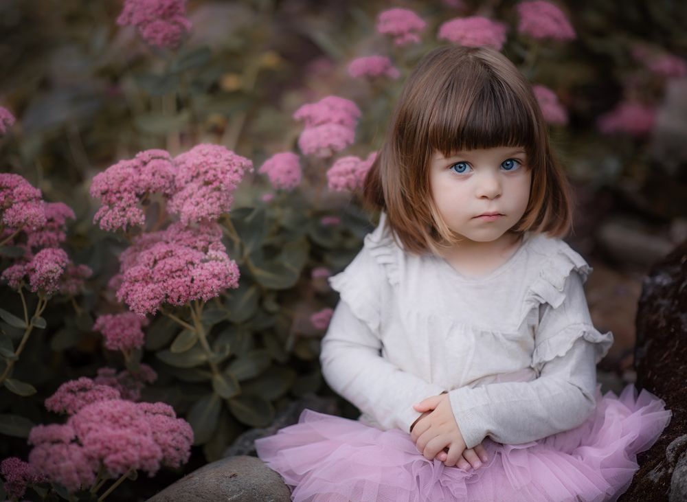 a girl's portrait session in pink with the pink flowers in the park in Caledon, Ontario