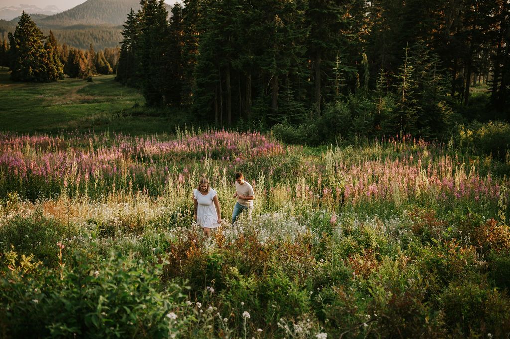 Couple walking in wildflower field Mt Washington Vancouver Island. Photography by Photographer Soulfull Photographs
