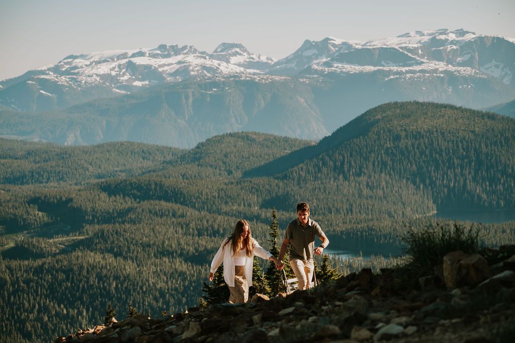 Couple engagement holding hands walking on top of Mt Washington Vancouver Island. Photography by Photographer Soulfull Photographs