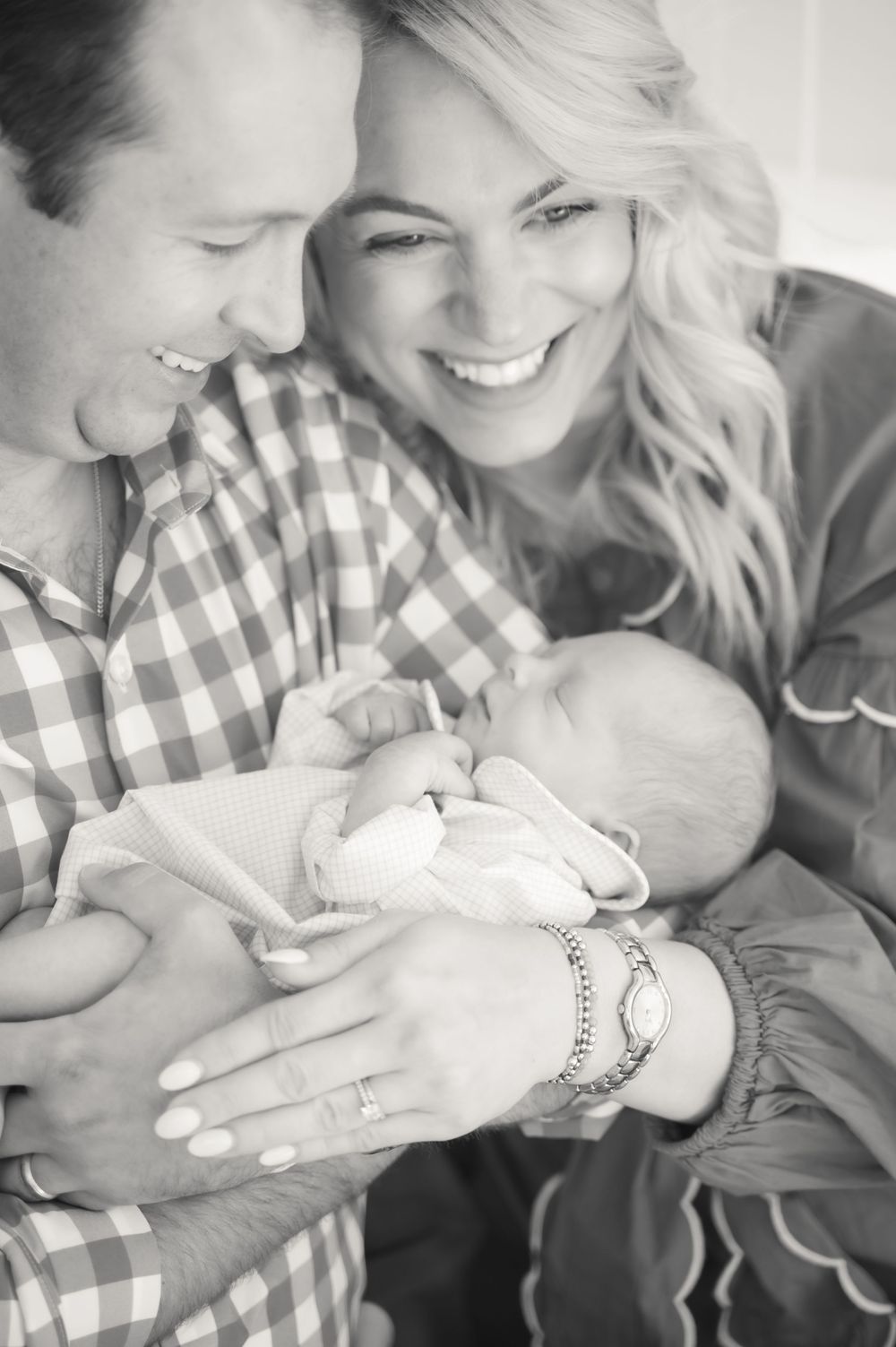 Black and white intimate portrait showing sweet expressions and tender moments in a home setting.