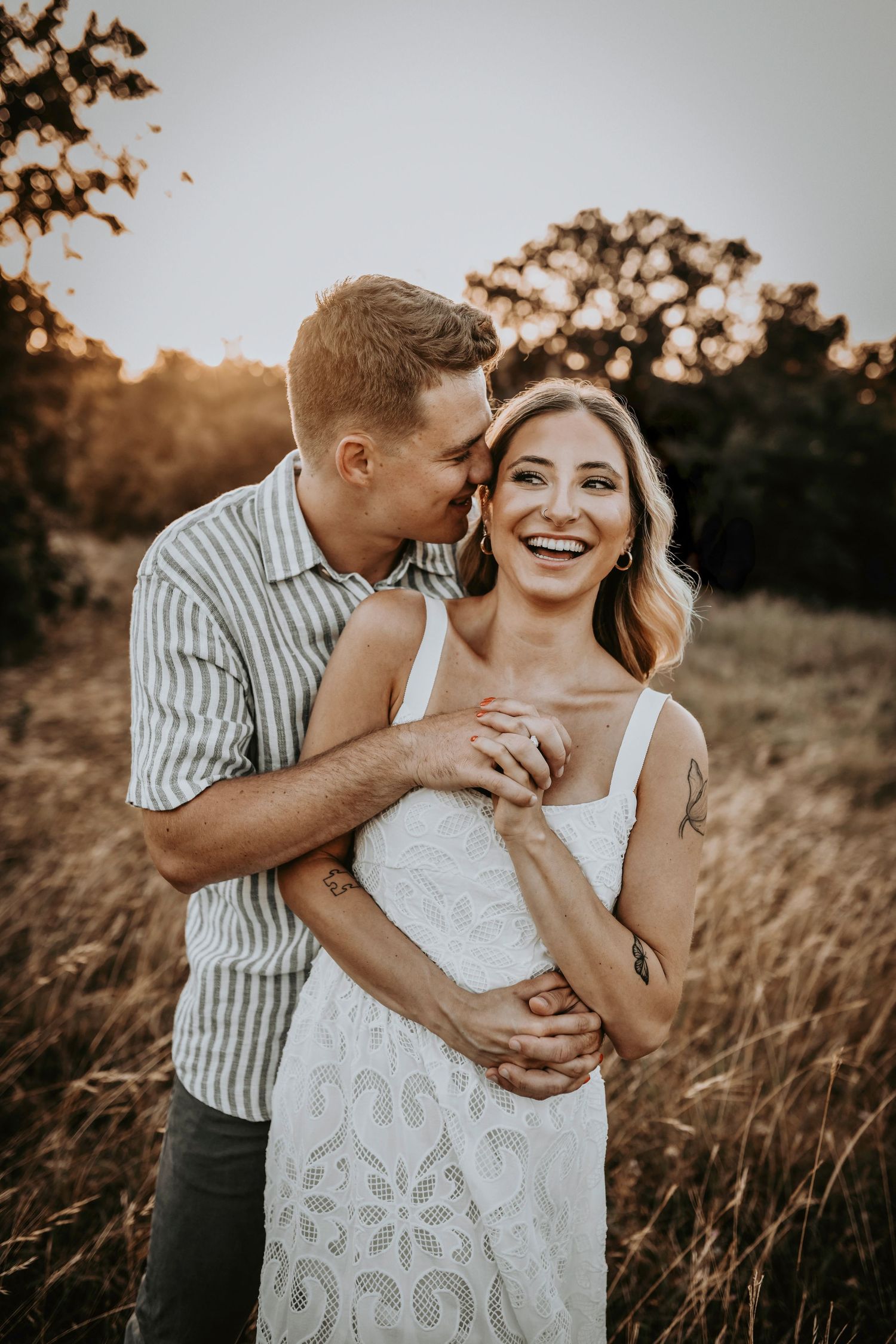 Magical golden hour kiss captured in wild grass