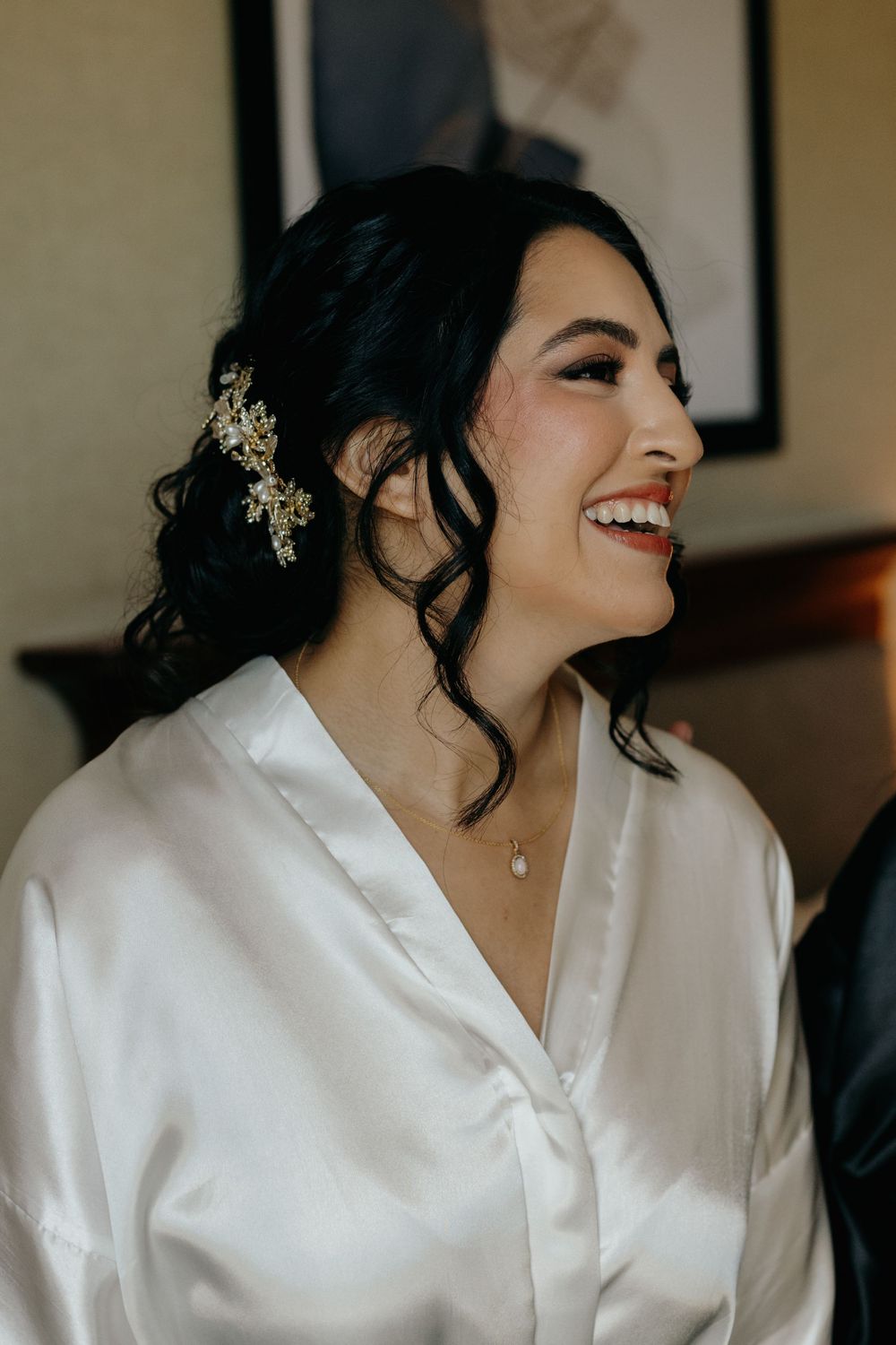 A series of candid getting-ready moments showing a person in a white satin robe with delicate hair accessories.