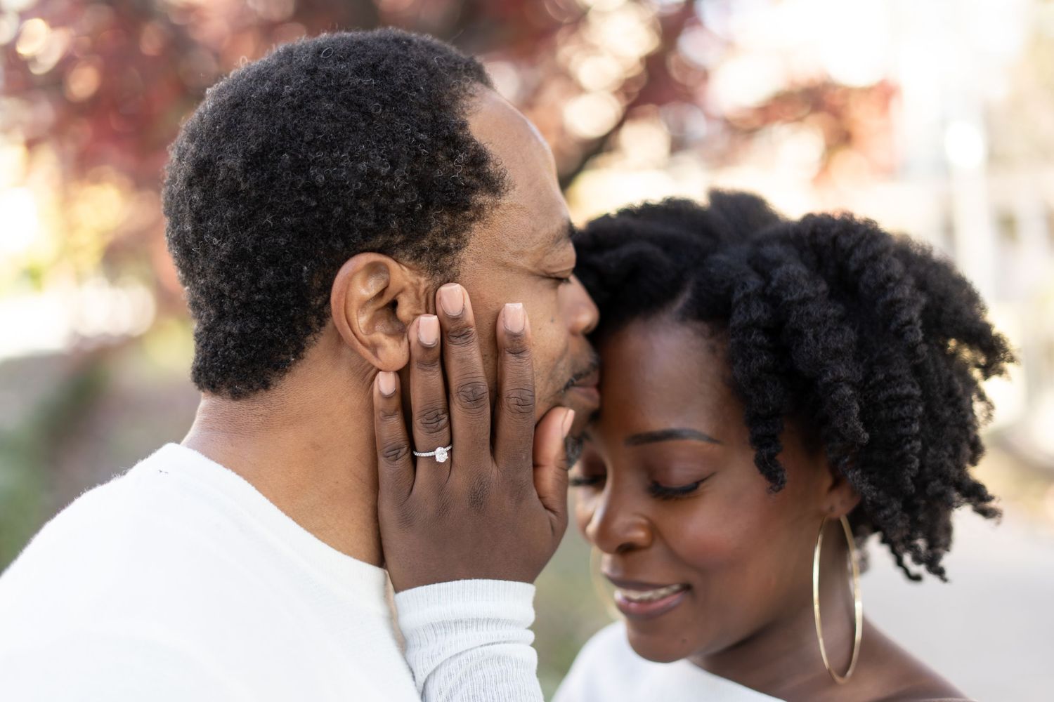 Close up portraits of a couple in romantic poses showing affection and loving connection during a photo session.