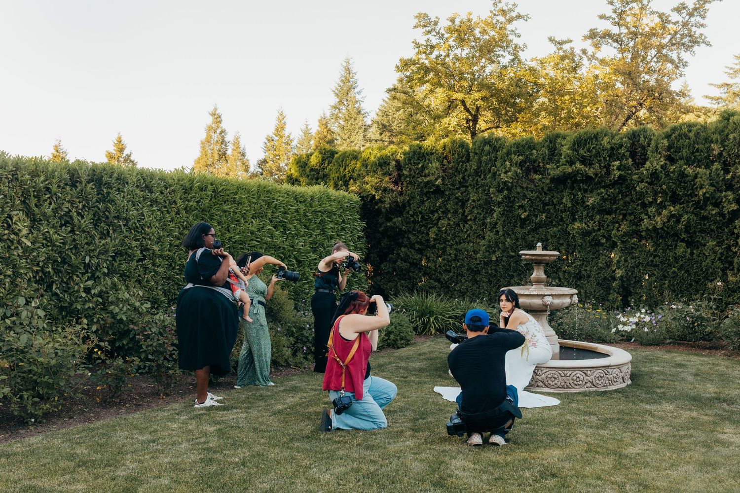 A series of candid moments captured in a backyard garden space during golden hour lighting.