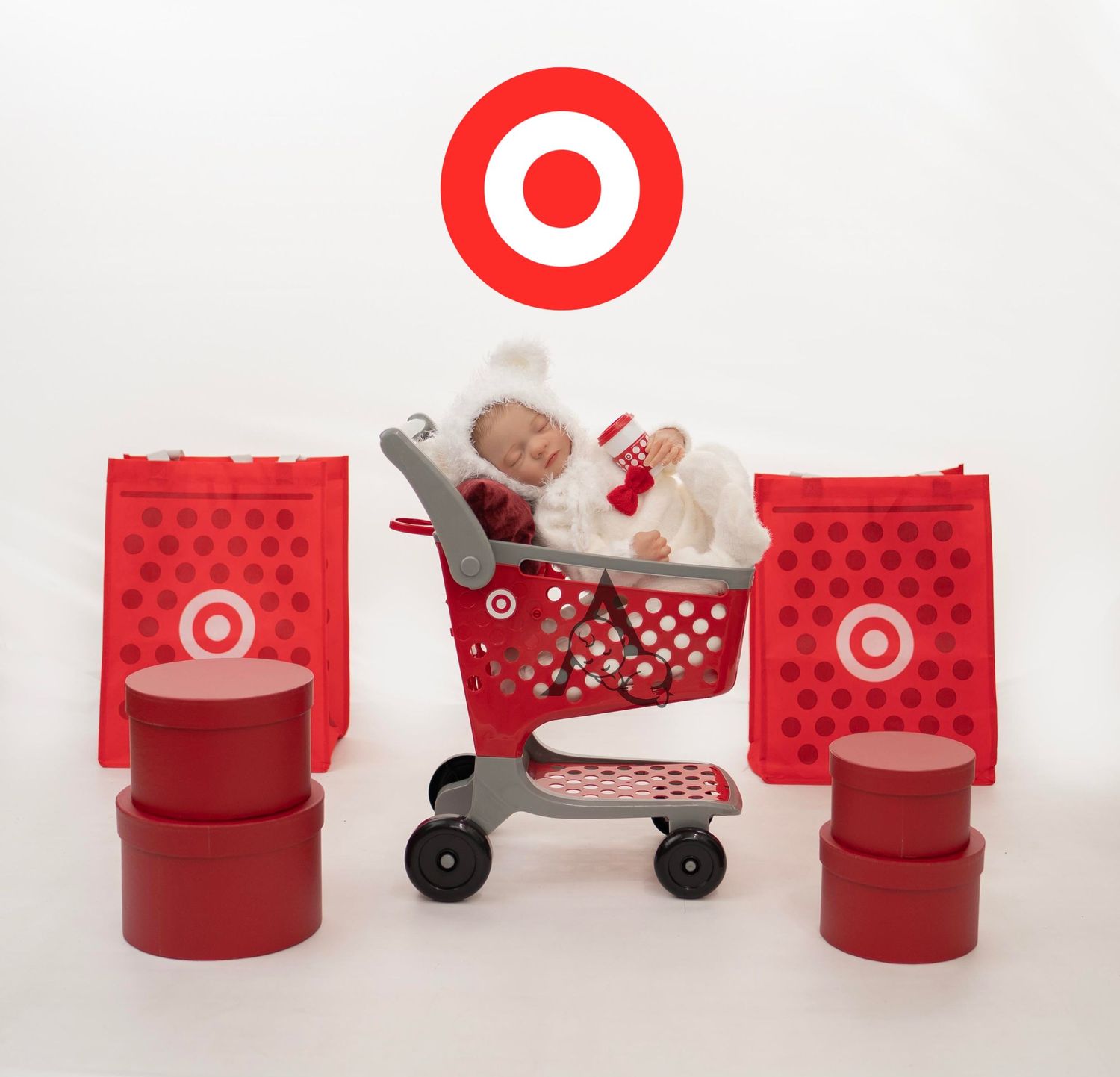 Creative newborn photo with Target shopping cart and red retail store theme.