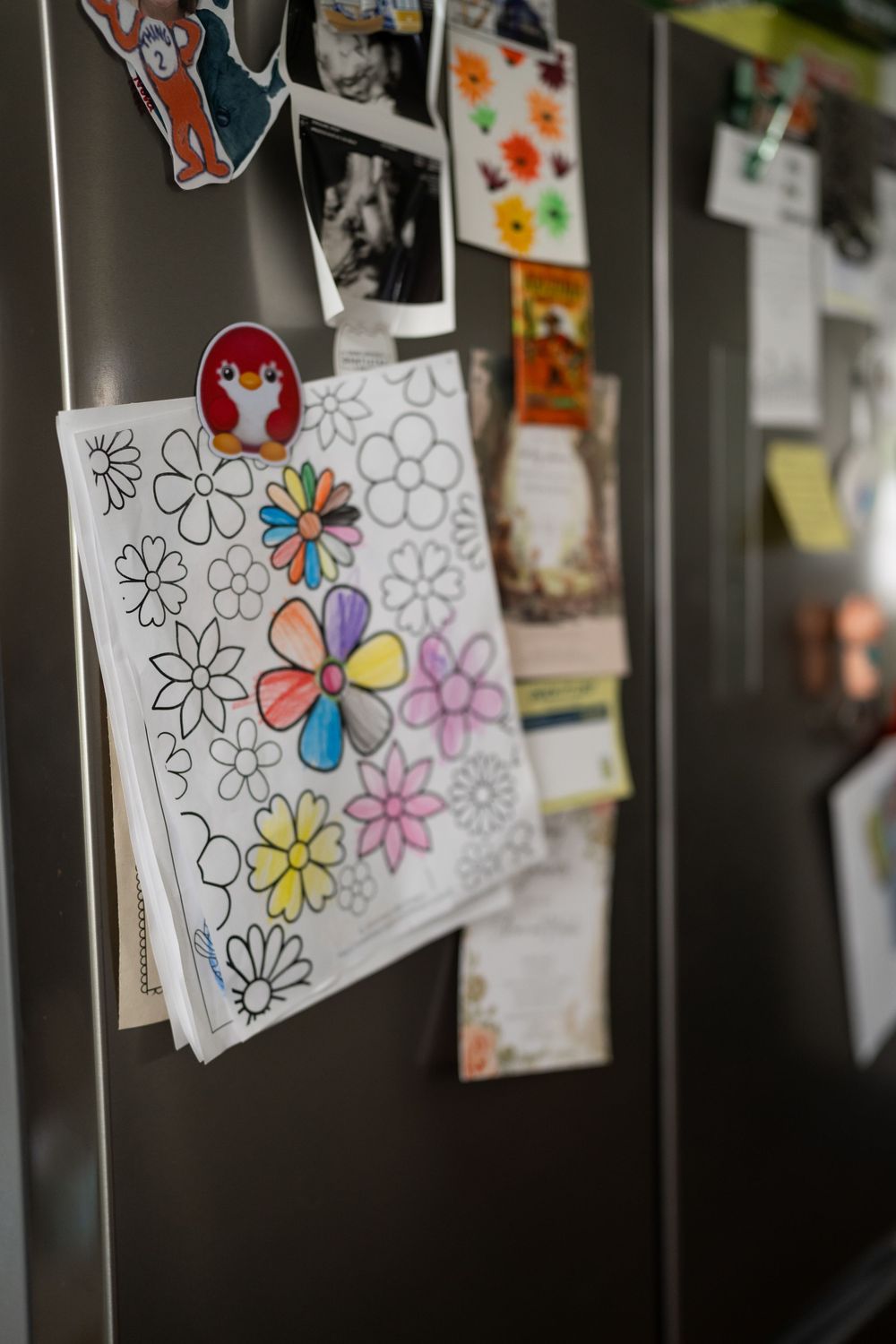 Documented Image of childs art hanging on fridge.
