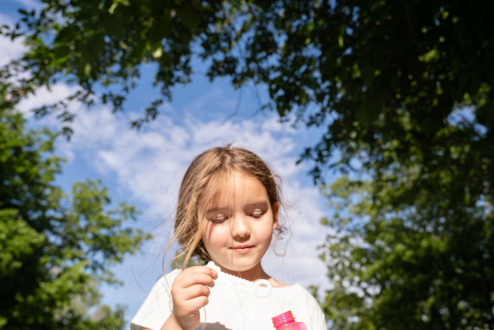 real life moment of girl blowing bubbles