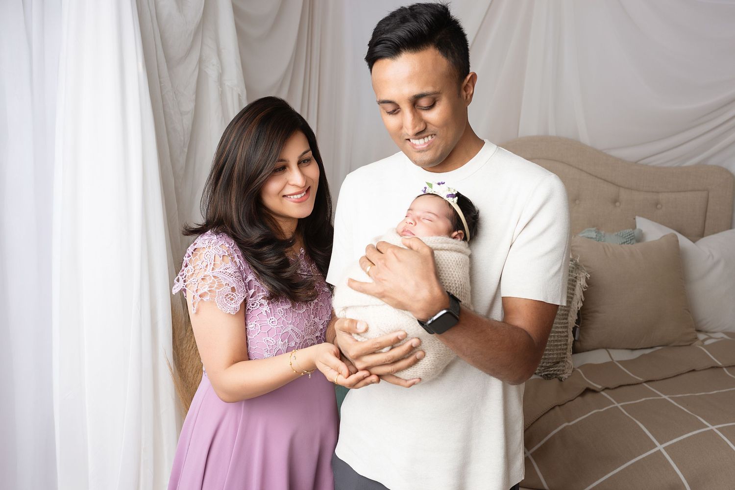 Lifestyle family photography with soft lighting and neutral color palette.
