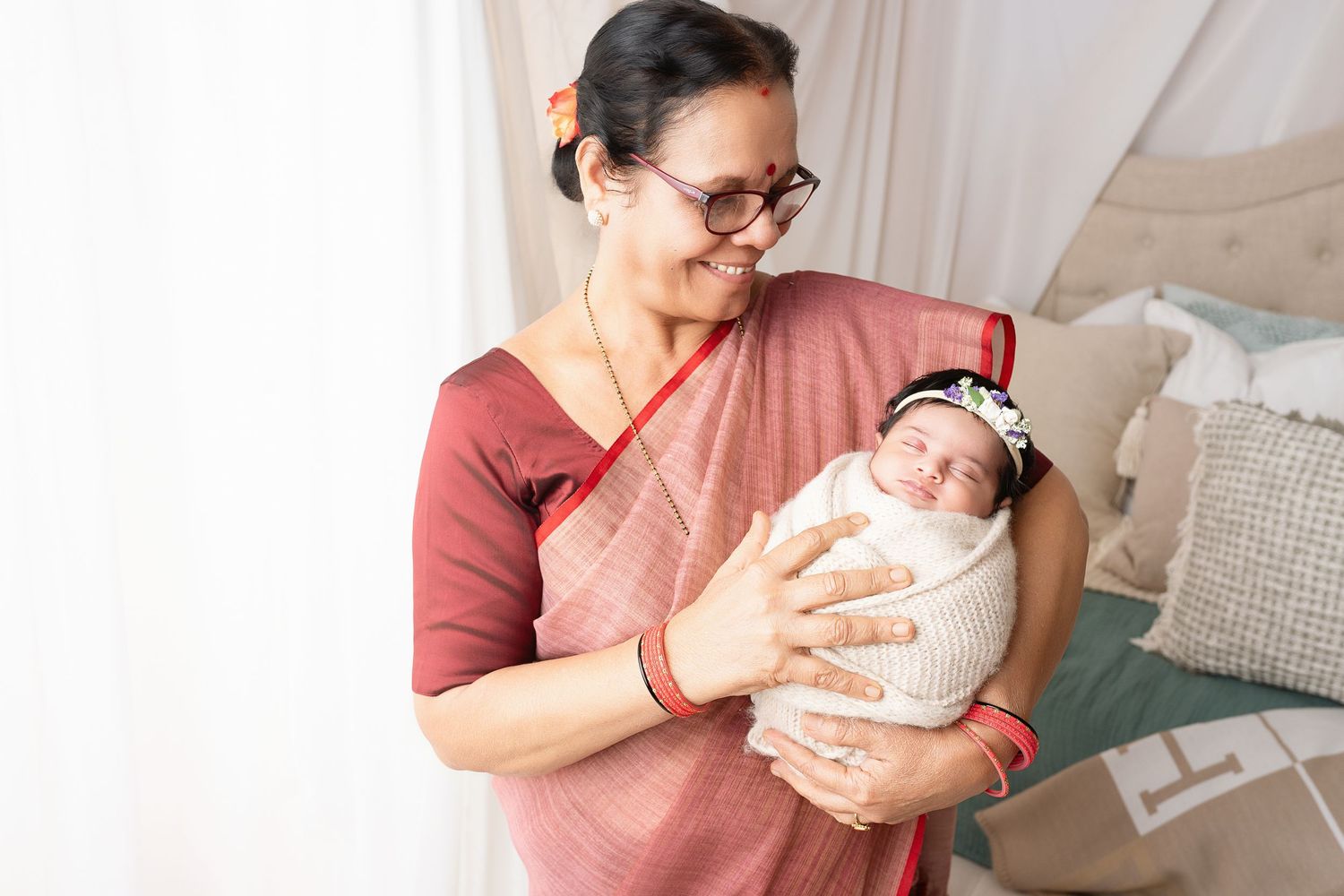 Intimate indoor family photography session with natural lighting and cozy setting.