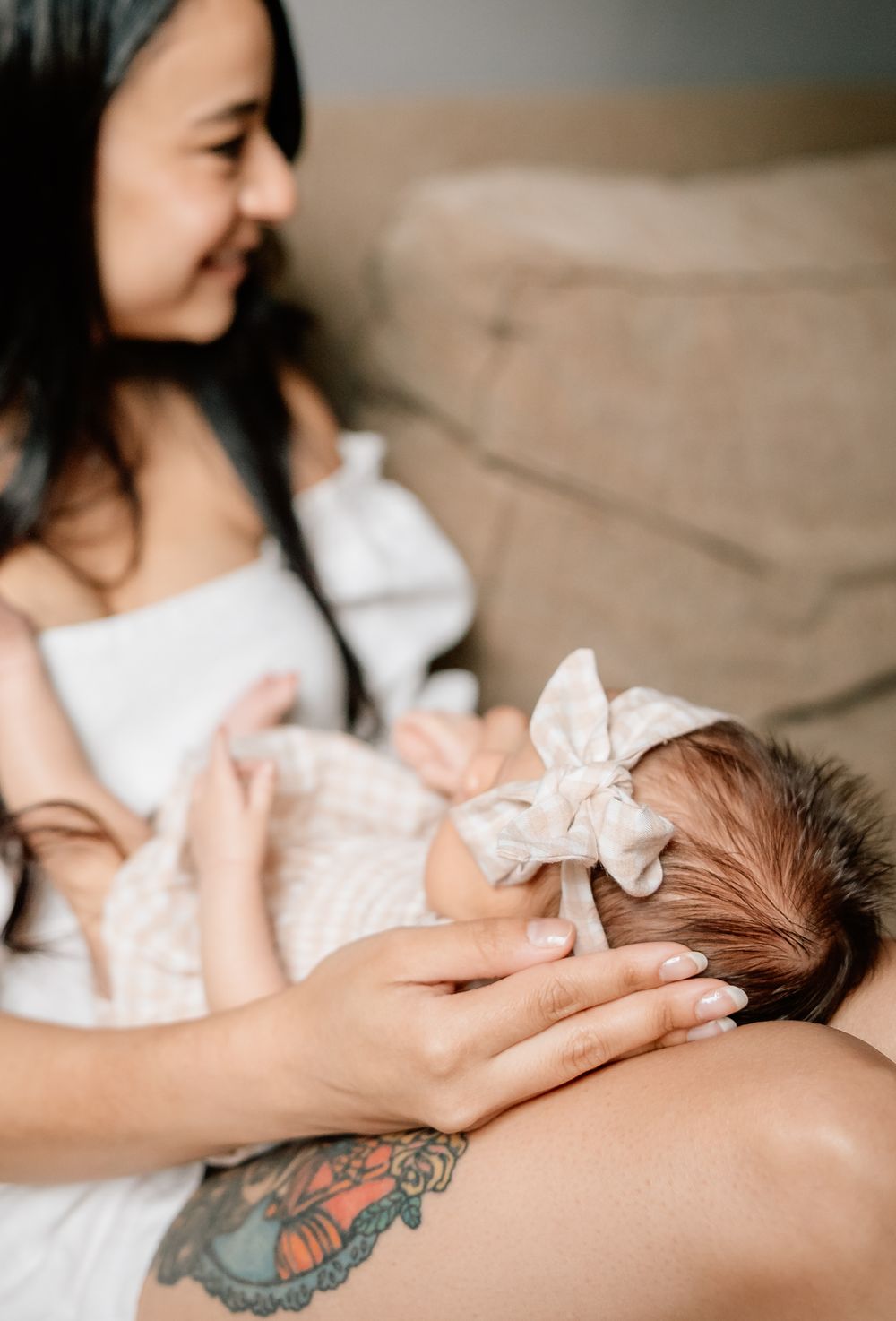 A series of five tender moments showing a mother gently feeding and nurturing her newborn baby.