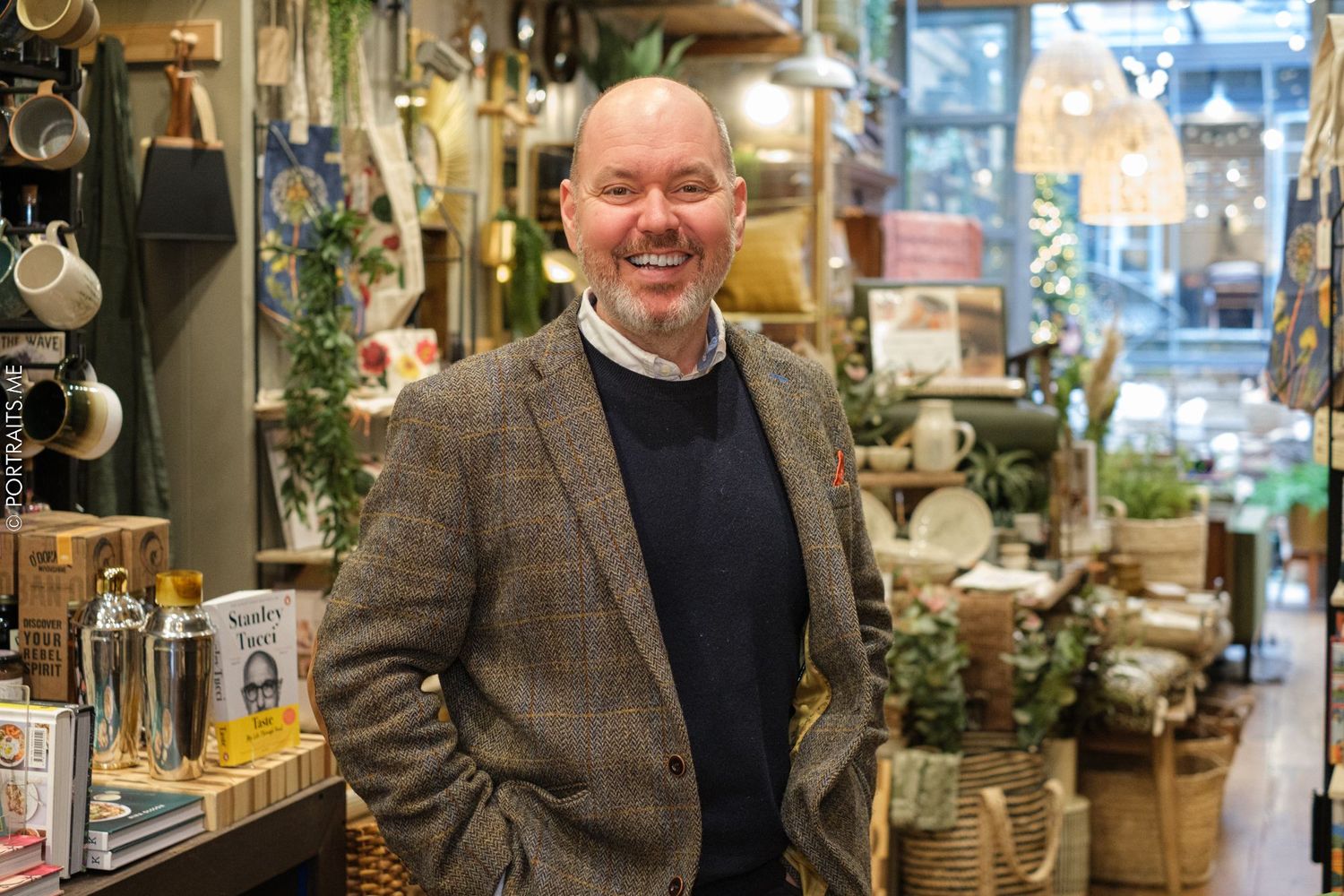 Interior of retail store with plants and home decor items on display.