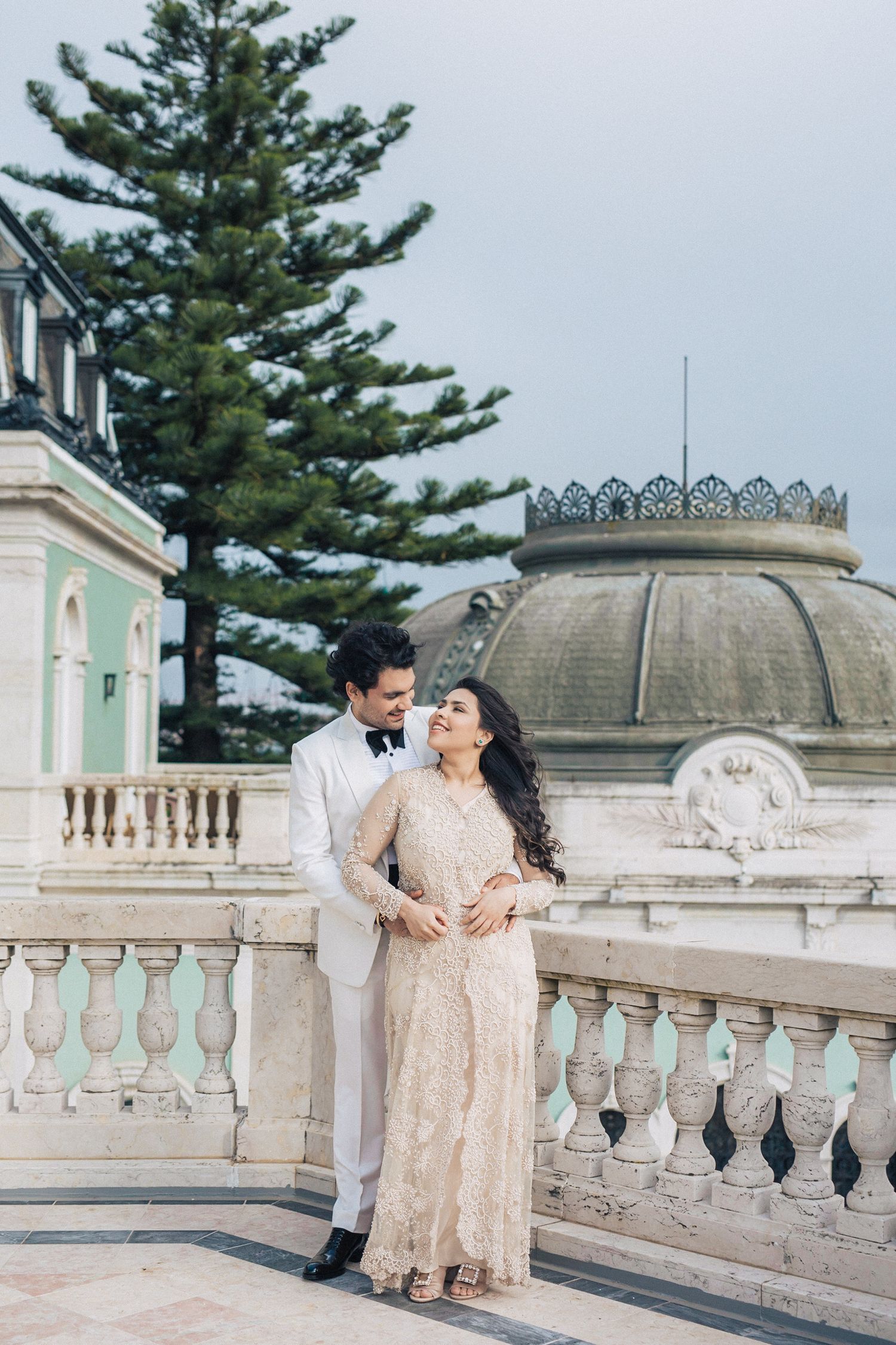 Cinematic couple portrait in a regal setting at Pestana Palace, a top wedding venue in Portugal.