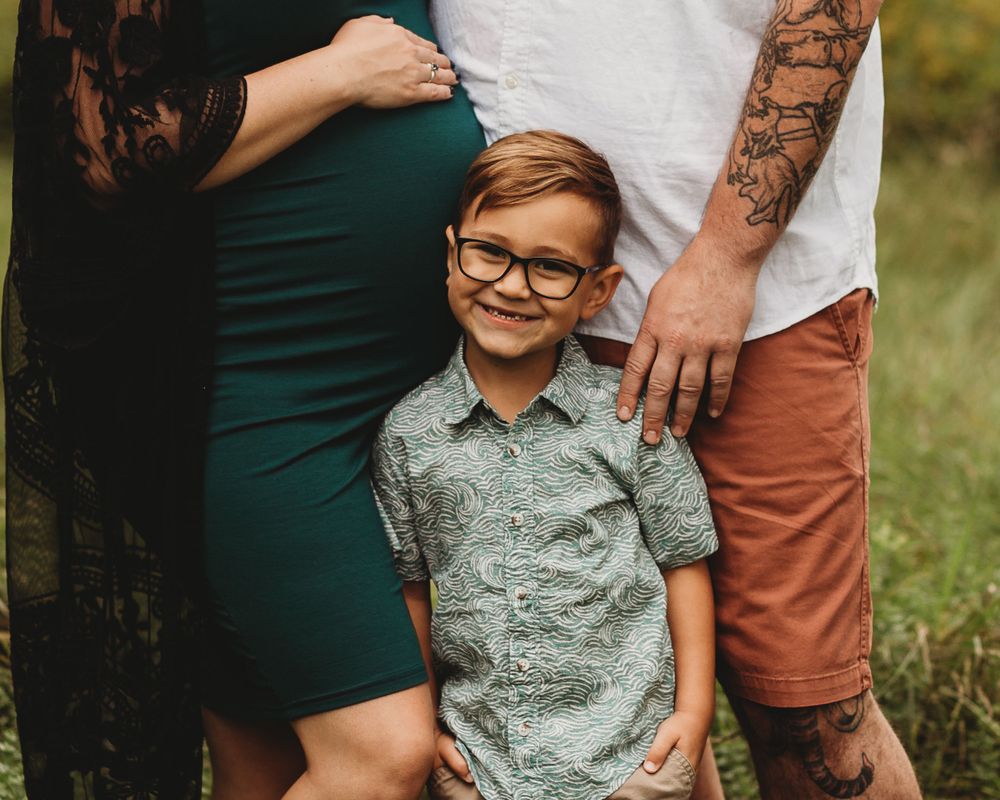 Professional maternity photo with dad and big brother