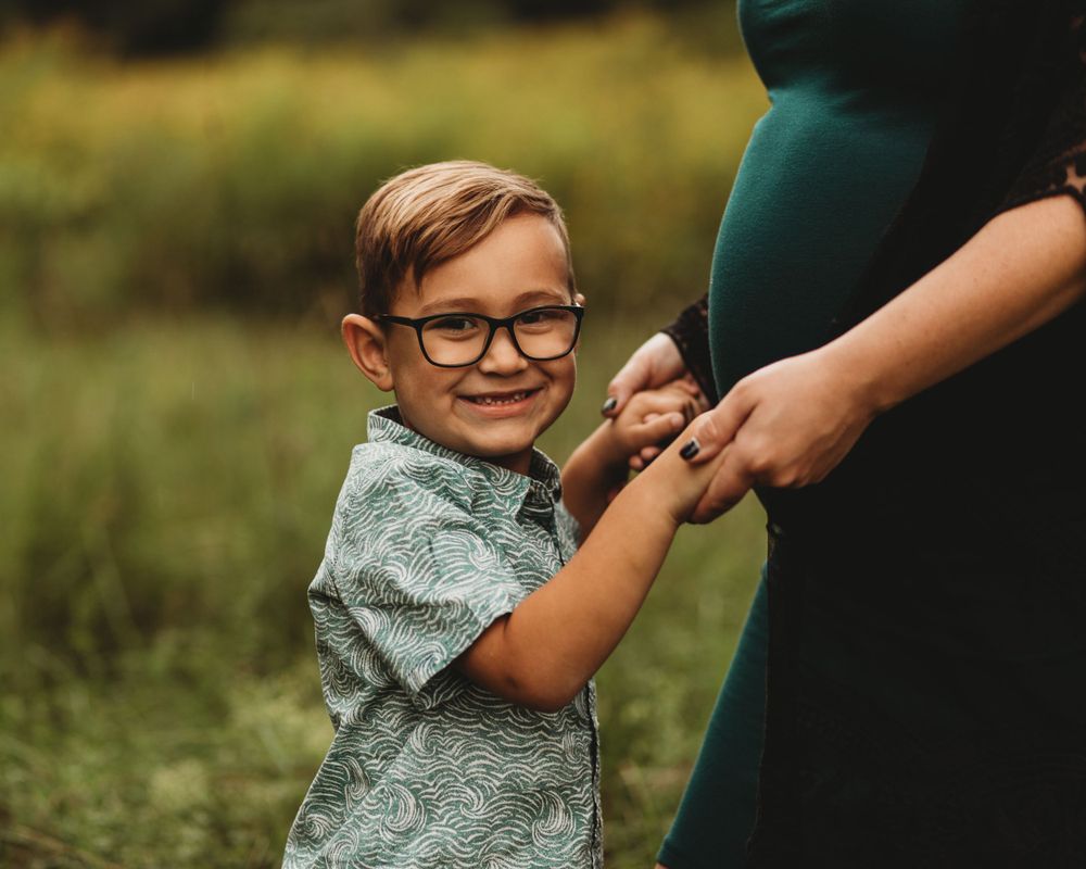 Professional maternity photo with big brother