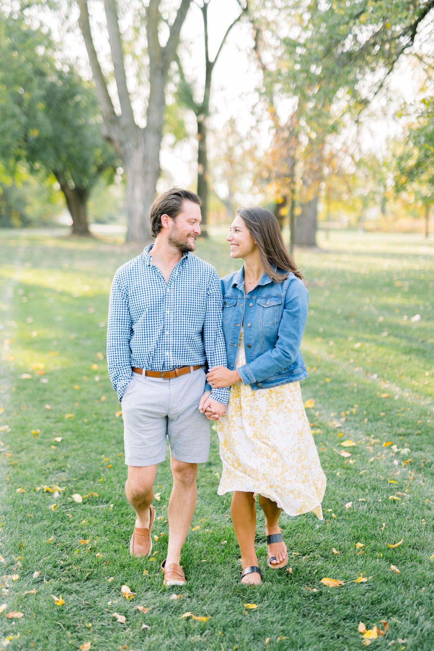 Des Moines Engagement photos at Grays Lake in downtown Des Moines, Iowa with light and airy photographer Nicole Laing
