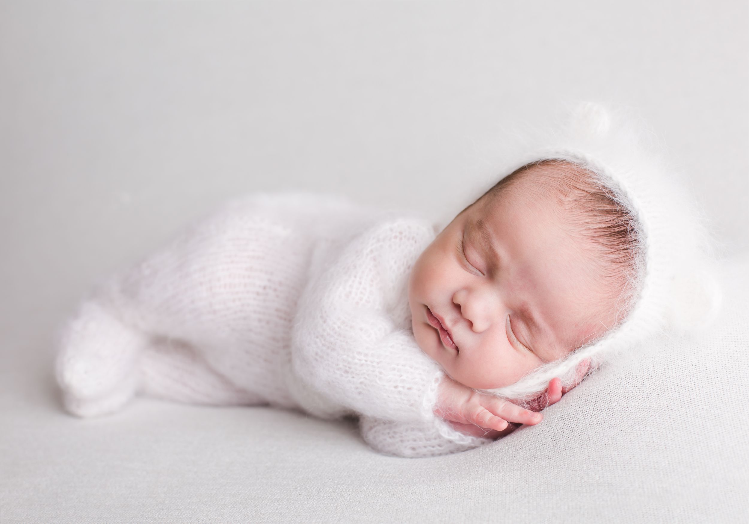 Newborn baby in bear hat for newborn photoshoot in Penticton and Kelowna BC