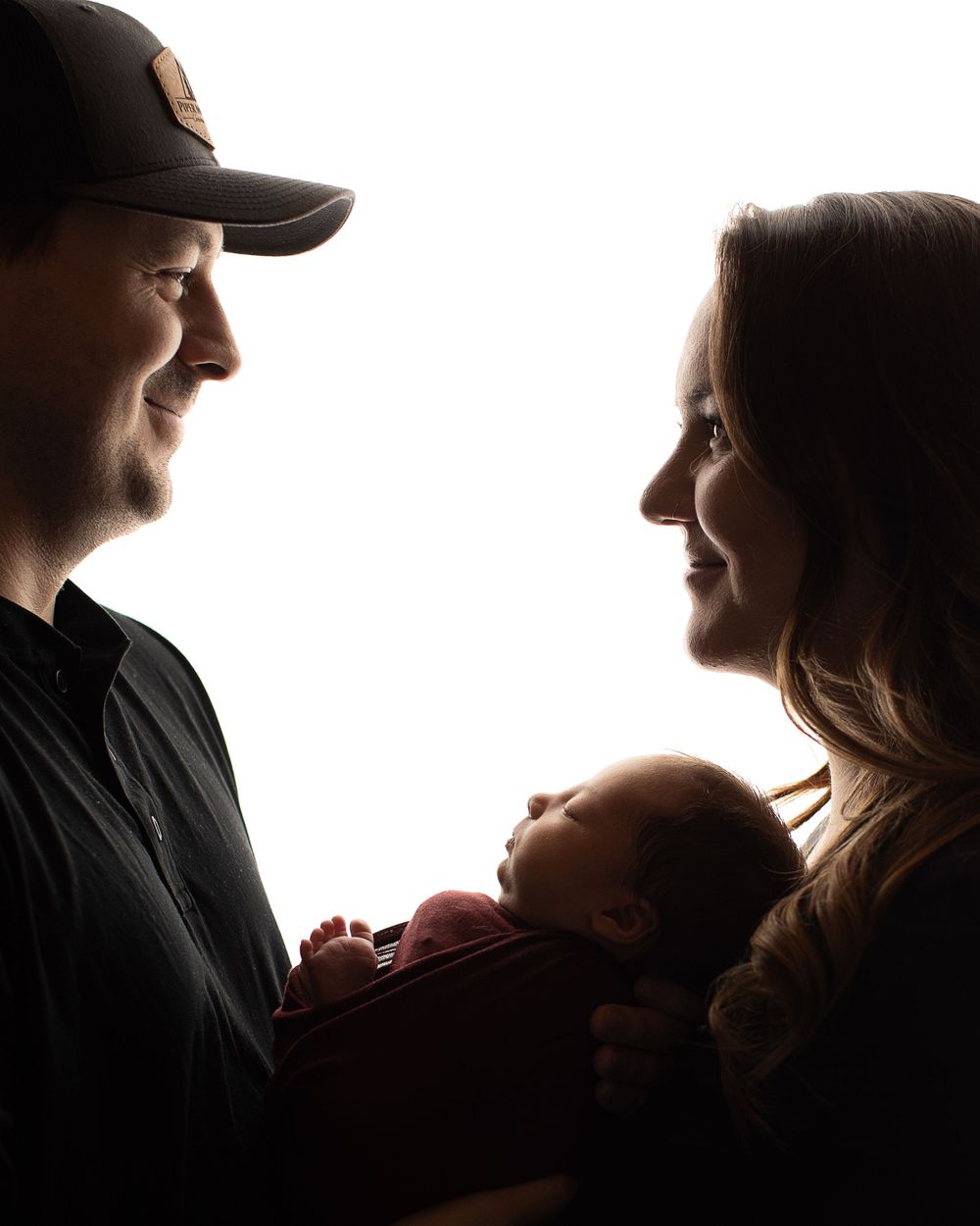 Professional newborn photo with mom and dad