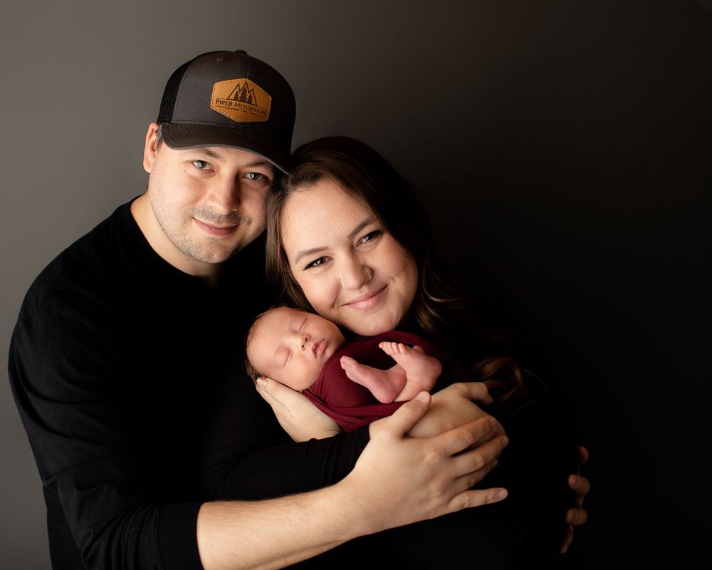 Professional newborn photo with mom and dad
