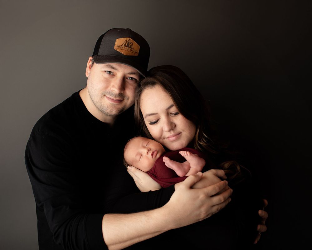 Professional newborn photo with mom and dad