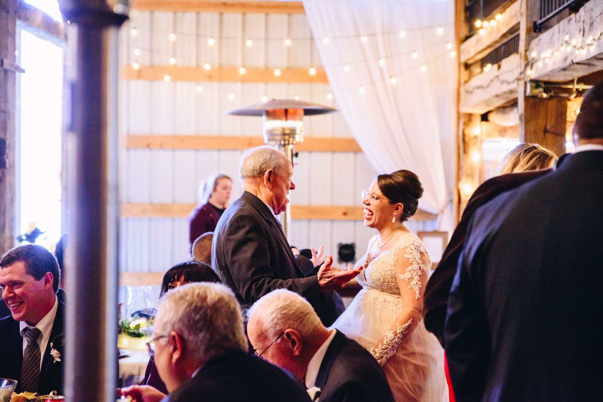 bride laughing with her father at a barn wedding in November near Cincinnati, OH