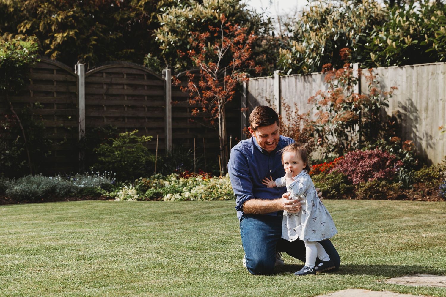 dad and daughter playing in garden