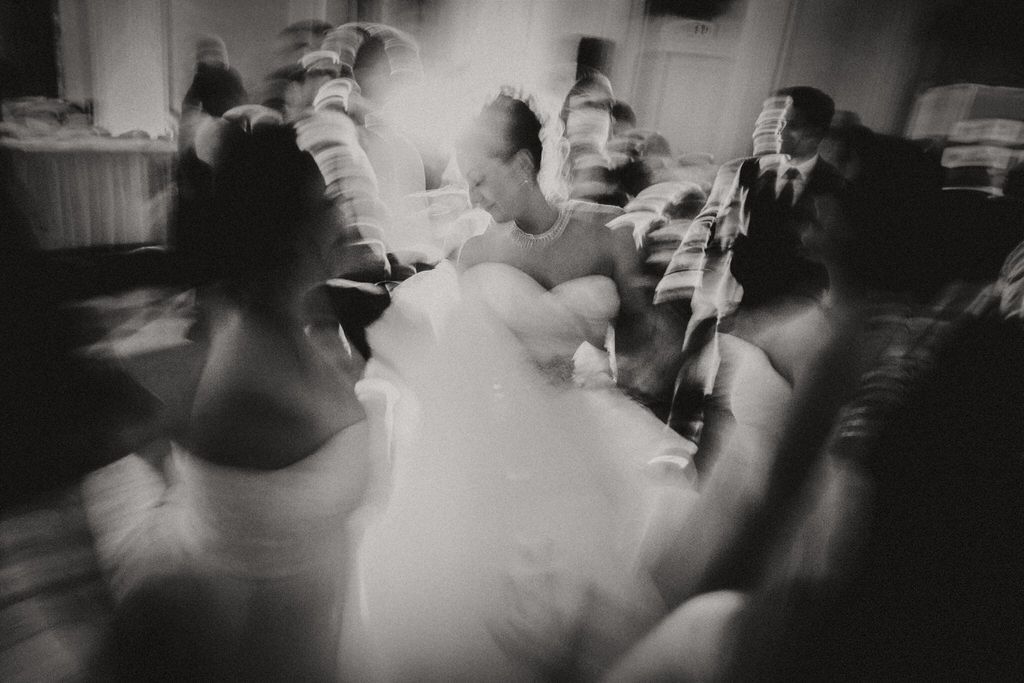 Bride and groom sharing a joyful moment during wedding reception dinner | Calgary wedding reception photography.