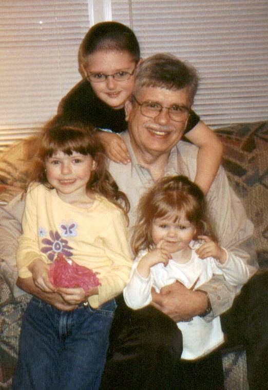 Vintage family photo showing warm moment between family members.