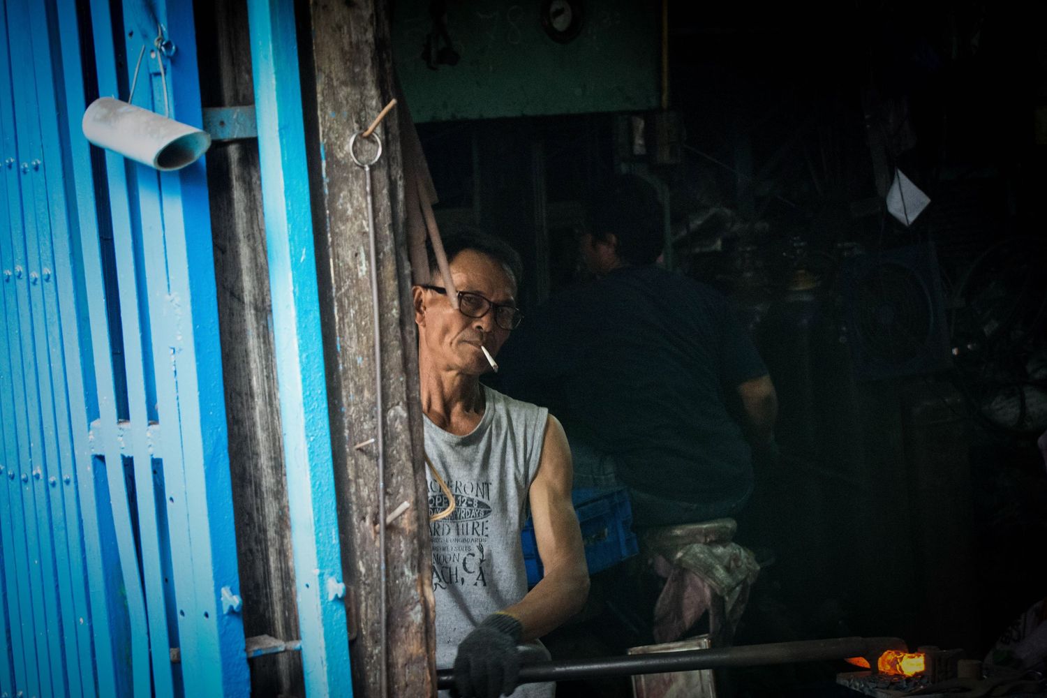 Environmental portrait metal worker in Bangkoks China town district