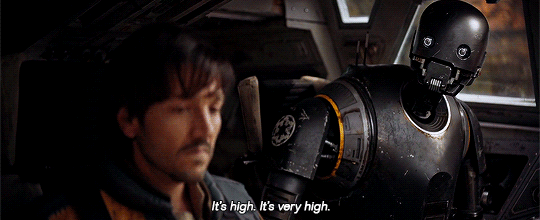 Android K-2SO telling Cassian Andor just how likely it is he'll get shot by Jyn Erso