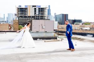 bride and groom have their first look and smile at each other on roof of Room 1520 in downtown Chicago