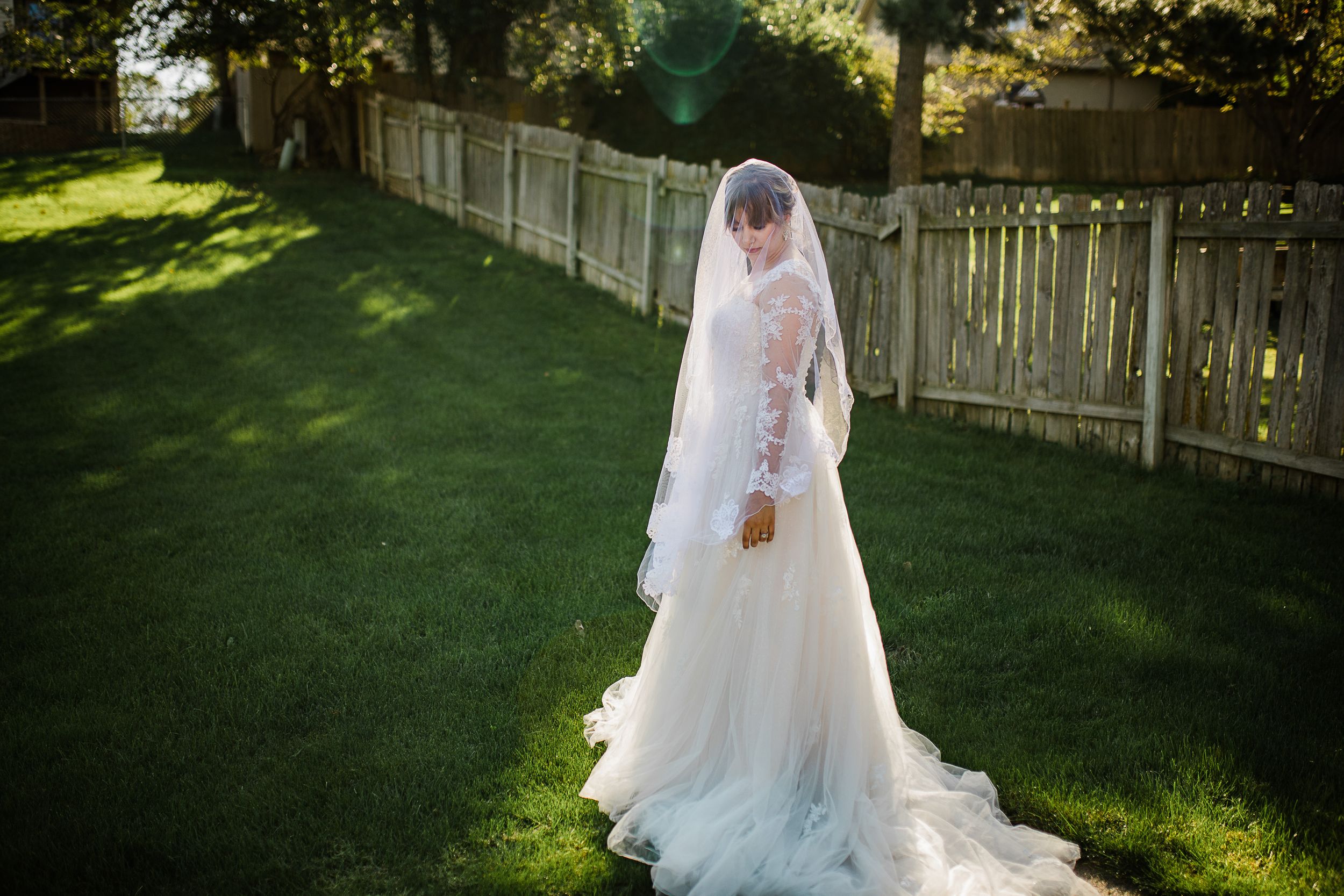 Bride in morning sunlight by Hudson Valley wedding photographer