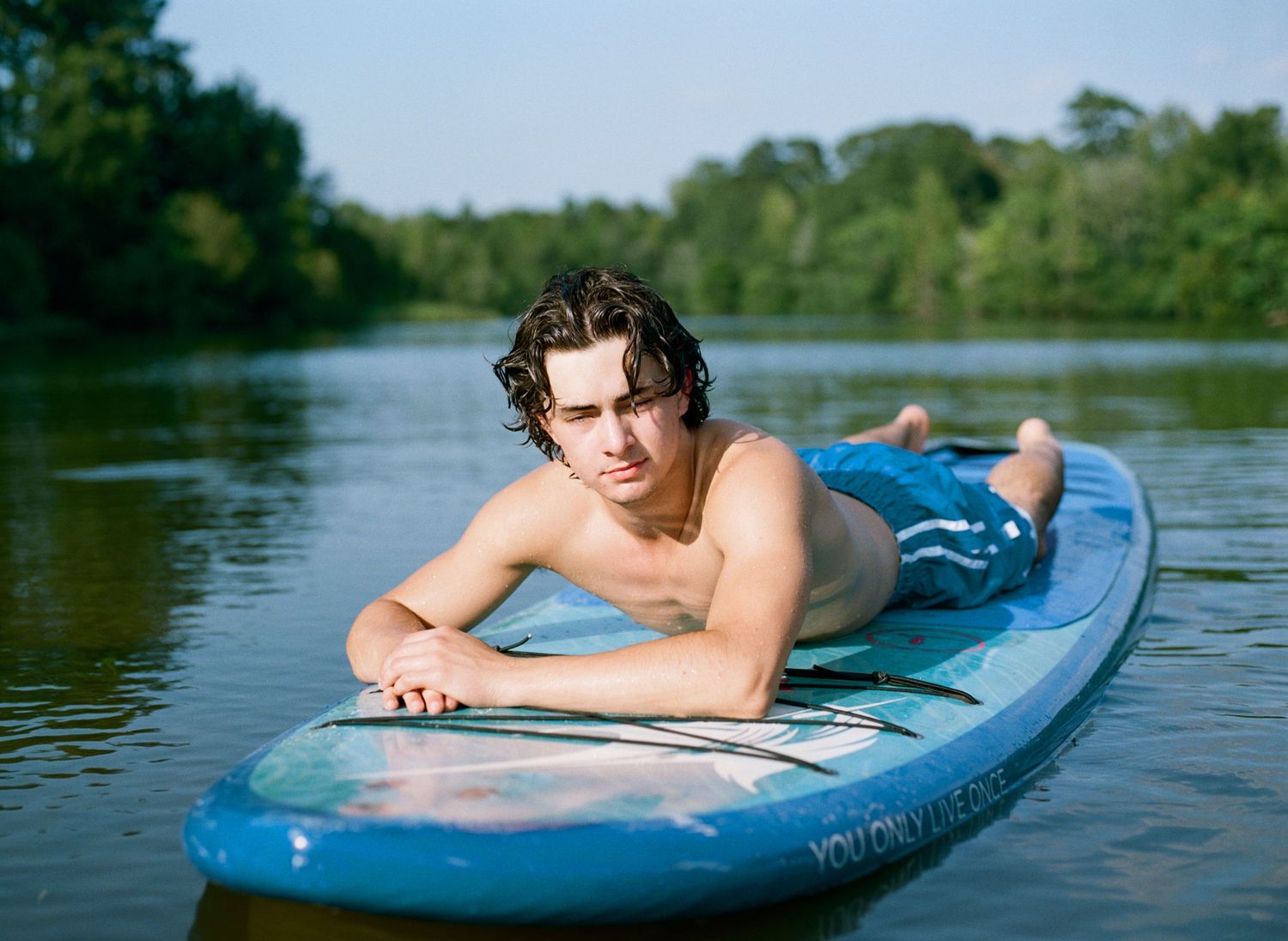A Bowling Green class of 2020 senior poses for senior pictures at his lake house near Franklinton
