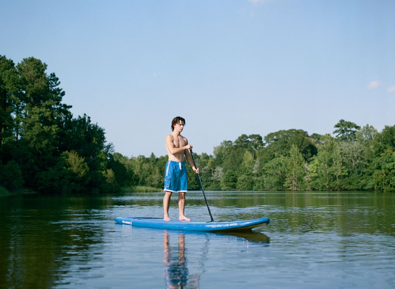 A Bowling Green class of 2020 senior poses for senior pictures at his lake house near Franklinton
