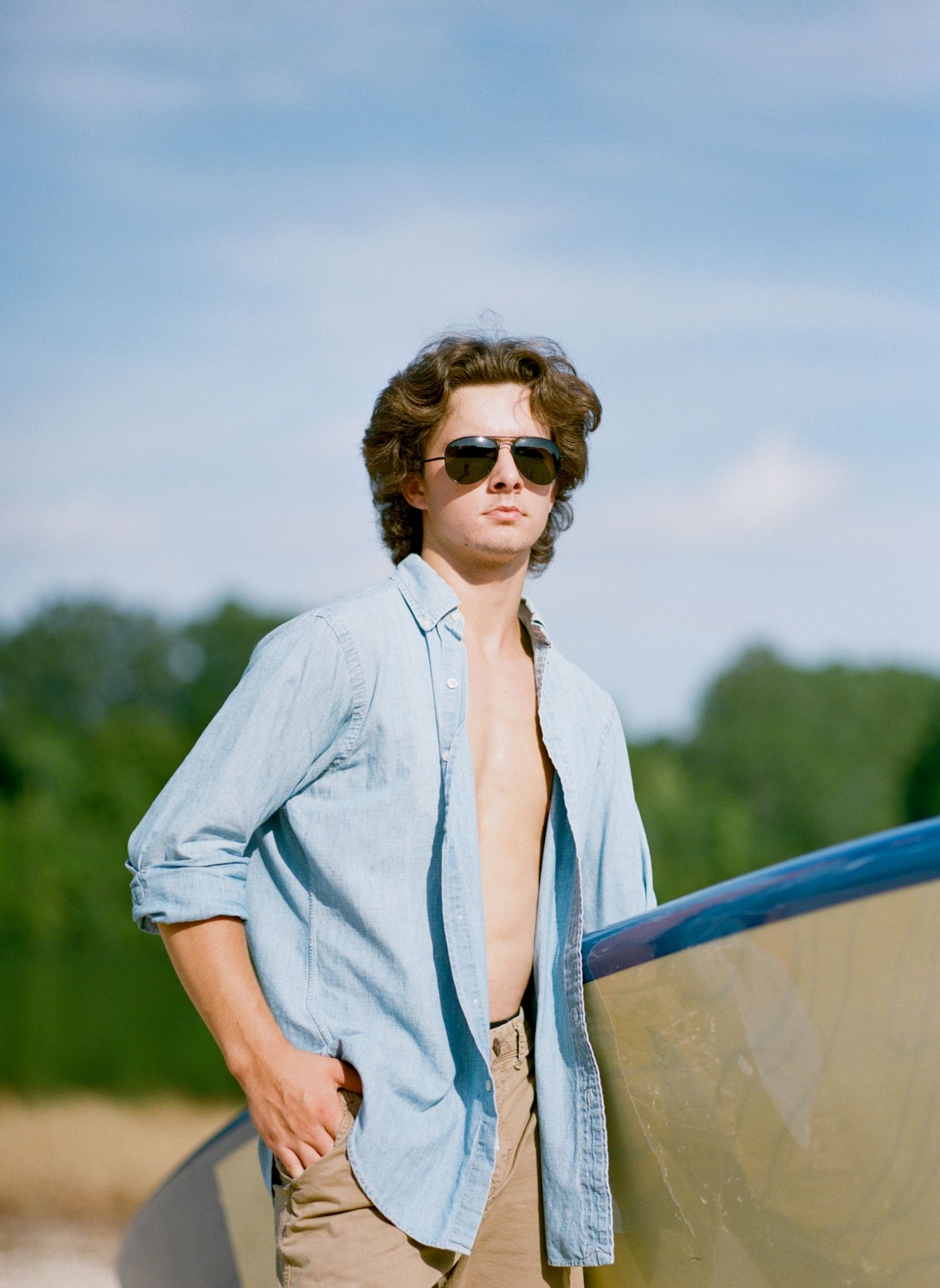 A Bowling Green class of 2020 senior poses for senior pictures at his lake house near Franklinton
