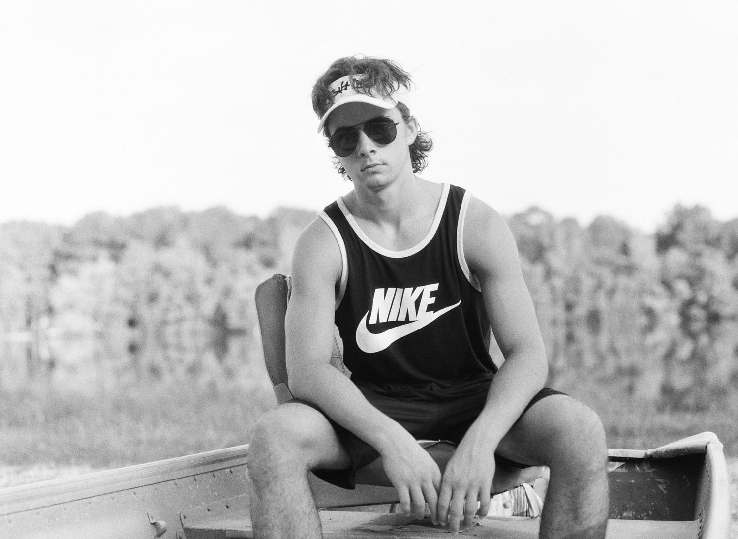 A Bowling Green class of 2020 senior poses for senior pictures at his lake house near Franklinton