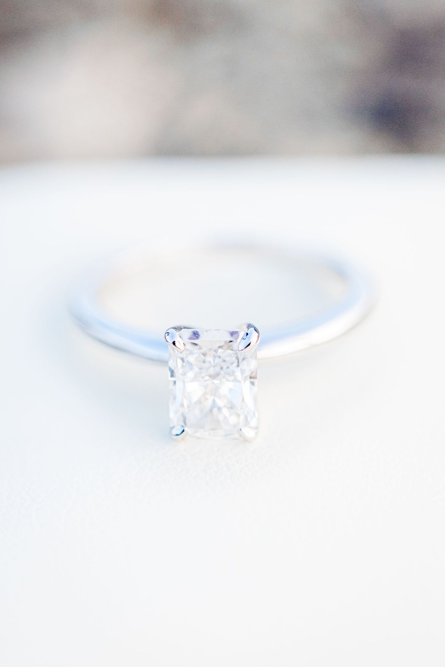 rectangle cut diamond engagement ring on white ring box after Chicago proposal
