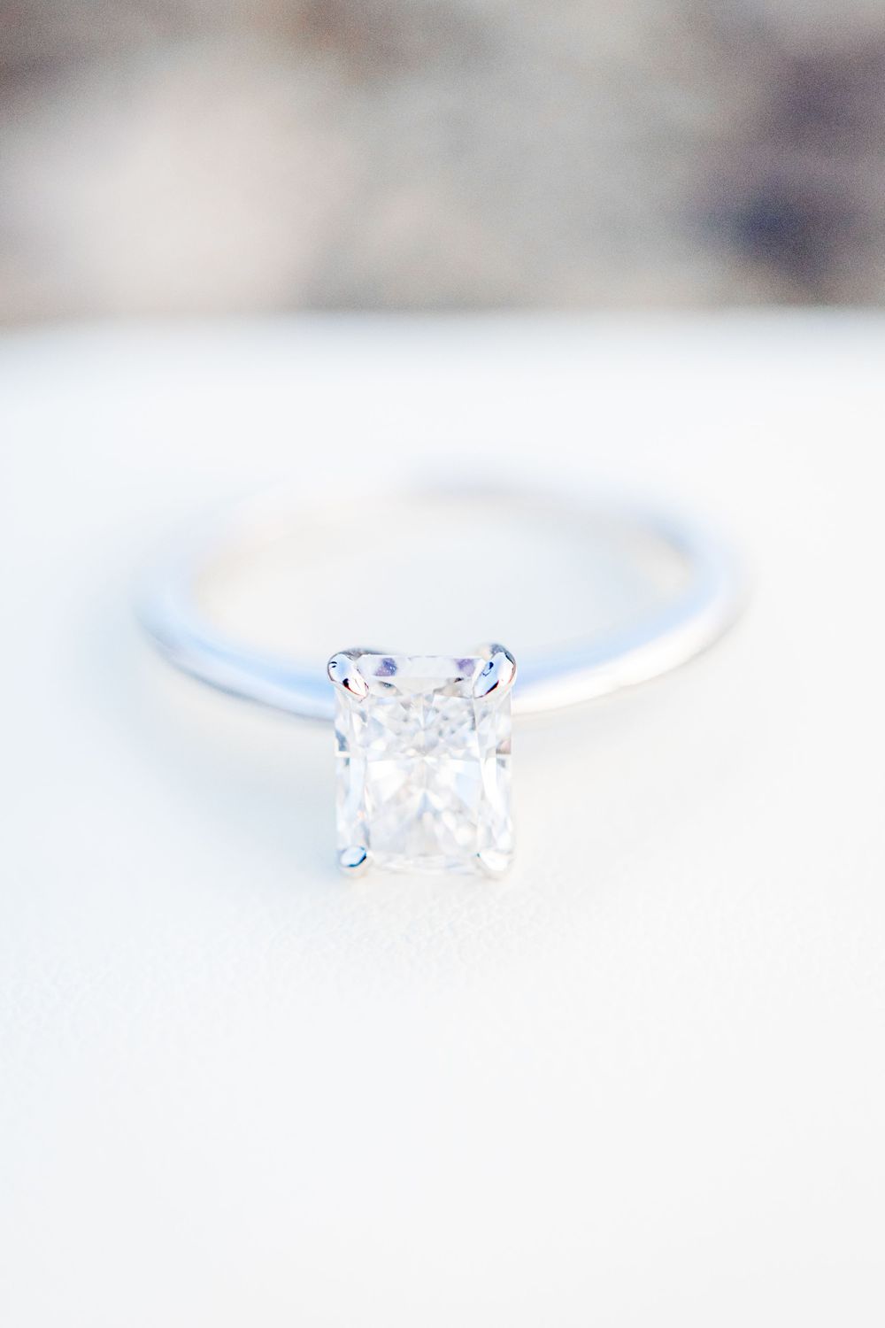 rectangle cut diamond engagement ring on white ring box after Chicago proposal