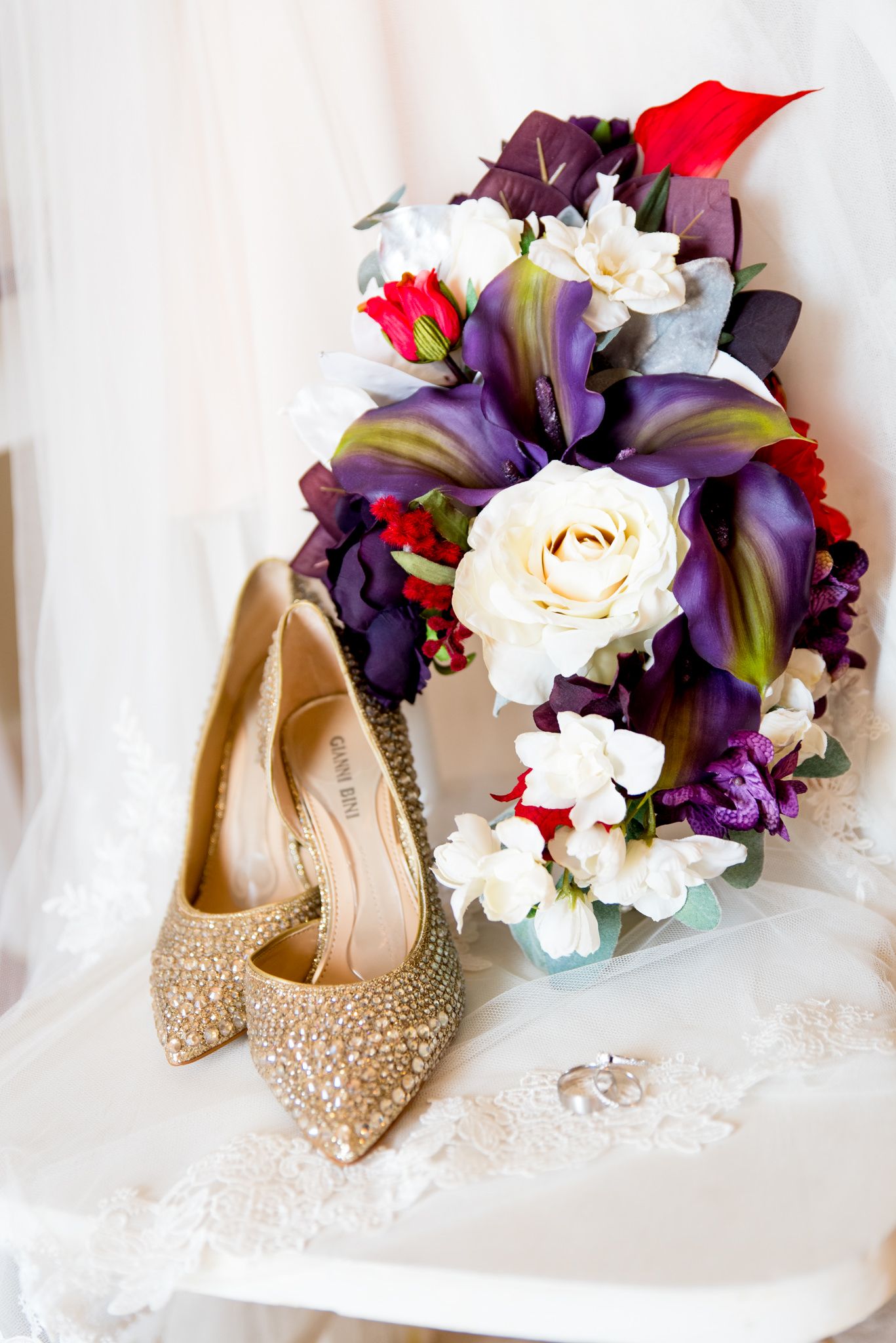 purple and red calalily wedding bouquet with rhinestone heels and wedding veil for fall wedding